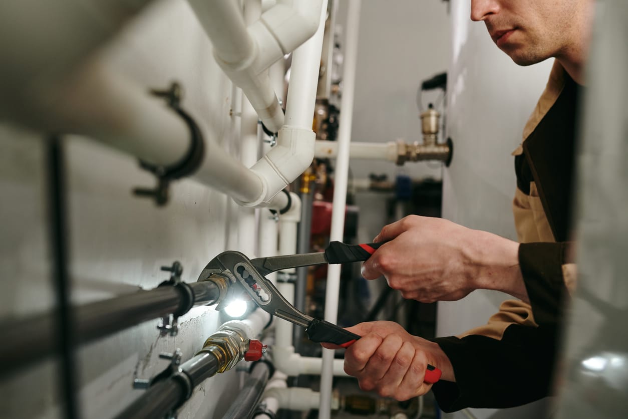 Plumbers maintaining commercial plumbing pipes in Miami Gardens